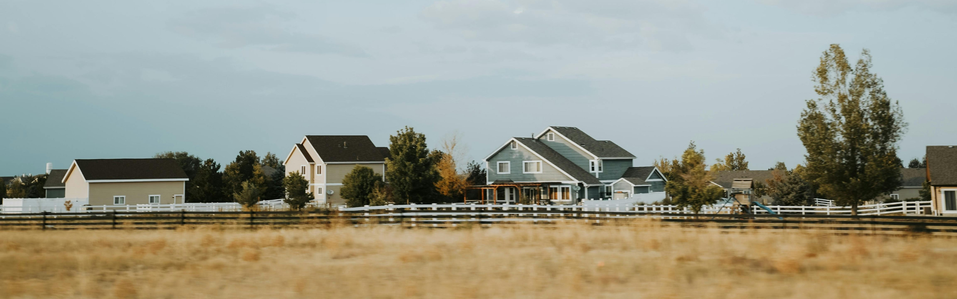 American neighborhood homes in warm golden light