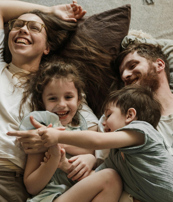 Happy young family laughing together